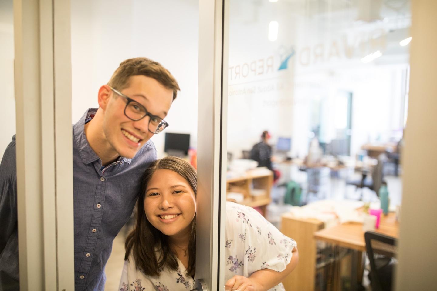 Two Interns smiling in a doorway at Rivard Report Office