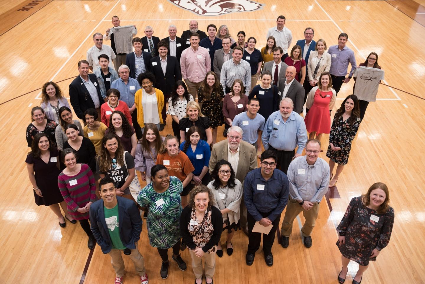 A large group of alumni and students in the 2019 1869 Scholars cohort